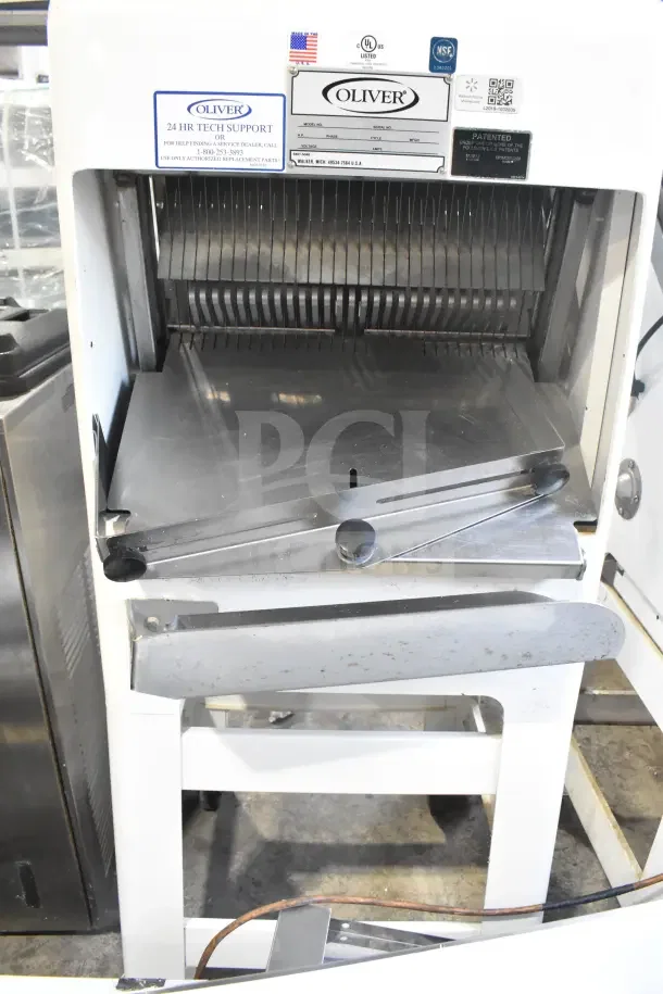 Oliver 797-32NC commercial bread slicer with Pro Guard Safety Chute, 115V, 1 phase, visible labels for tech support and safety.