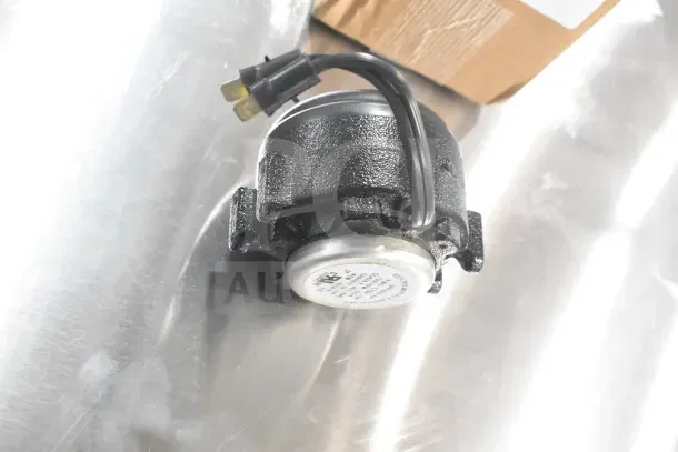 Brand new Delfield 2162667 fan motor, 115v/60hz, metal legs, minor scratches, two items included, label visible.