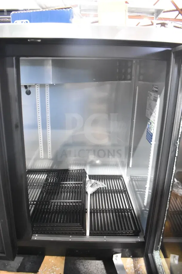 Brand new True TBB-2G-HC-LD commercial bar cooler, two doors, shelves inside, visible labels, 115V, 1 Phase, scratch and dent.