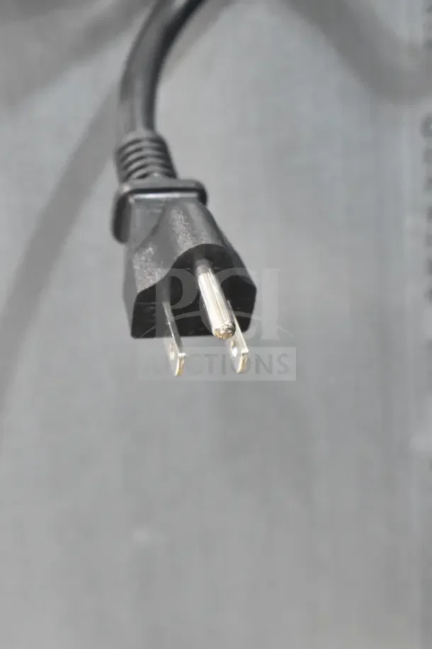 Close-up of a power plug for the 2025 Avantco 194EUCF230A Undercounter Ice Machine, 115 Volts, shown against a gray background.