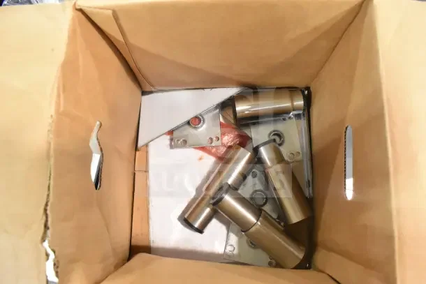 Parts for 2026 Hoshizaki AM-50BAK ice machine in a cardboard box. New condition. Mixed metal components visible.