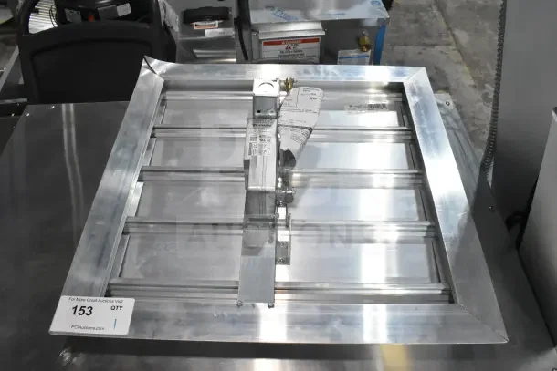 Brand new Canarm 3200 Series 20" x 20" motorized shutter backdraft damper, SX3220X20, with visible labels and tags.