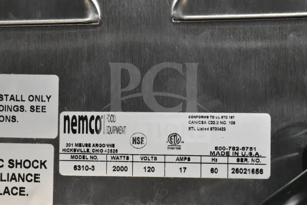 Alt text: Nemco 6310-3 Electric Hot Plate, 120V, 1 Phase, 2 burners. Model info and labels visible; brand new with minor scratches.