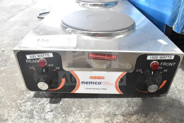 BRAND NEW Nemco 6310-3 electric hot plate, 2 solid burners, 120V, 1 phase. Minor scratches and dents. 1500W front, 500W rear.