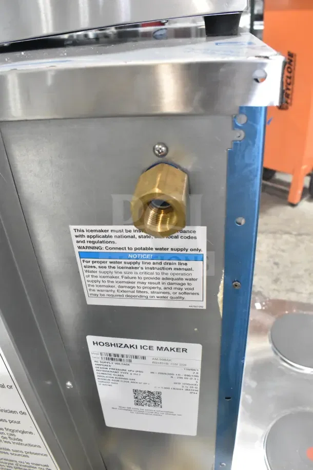 BRAND NEW SCRATCH AND DENT Hoshizaki AM-50BAK Ice Machine with 27 lb. Bin, labels detail specs.