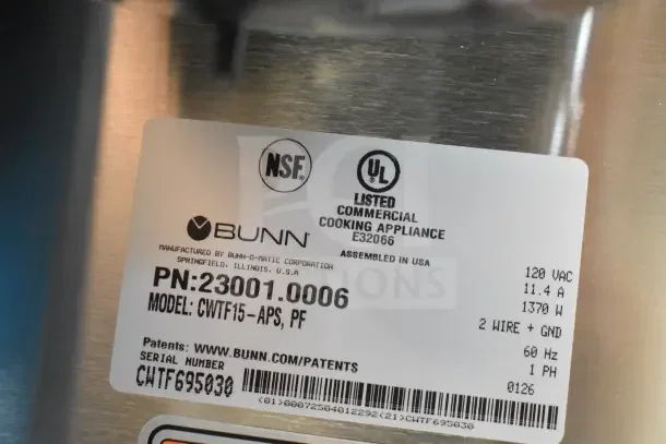 Alt text: "Bunn CWTF15-APS automatic airpot coffee brewer label, model 23001.0006, 120 Volts, new condition, with NSF and UL certifications."