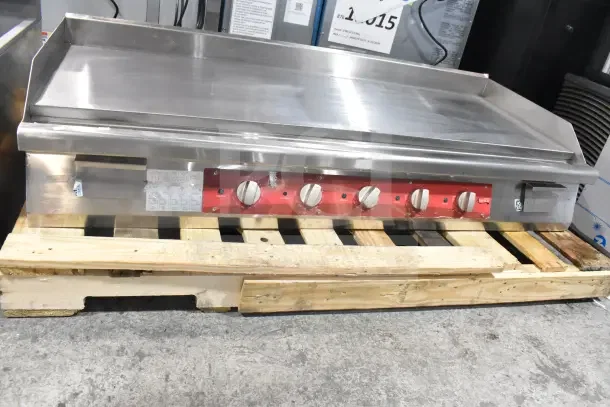 Brand new Avantco 177EG60C 60" electric griddle, scratch and dent condition, stainless steel, on pallet, 208V, 1 phase.