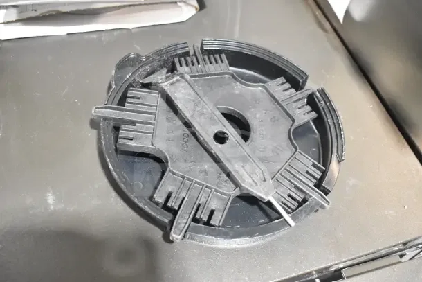 Brand new Robot Coupe CL50 Series E food processor blade, black plastic, Tex-Mex dice, visible markings, scratch and dent condition.