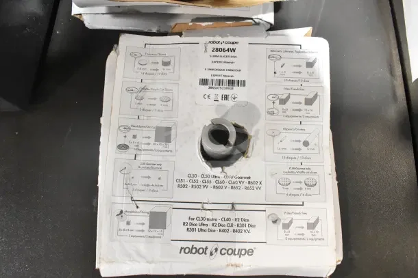 Robot Coupe CL50 Series E food processor packaging with diagram labels. Model features slicing and dicing discs. 120V, 1 Phase.