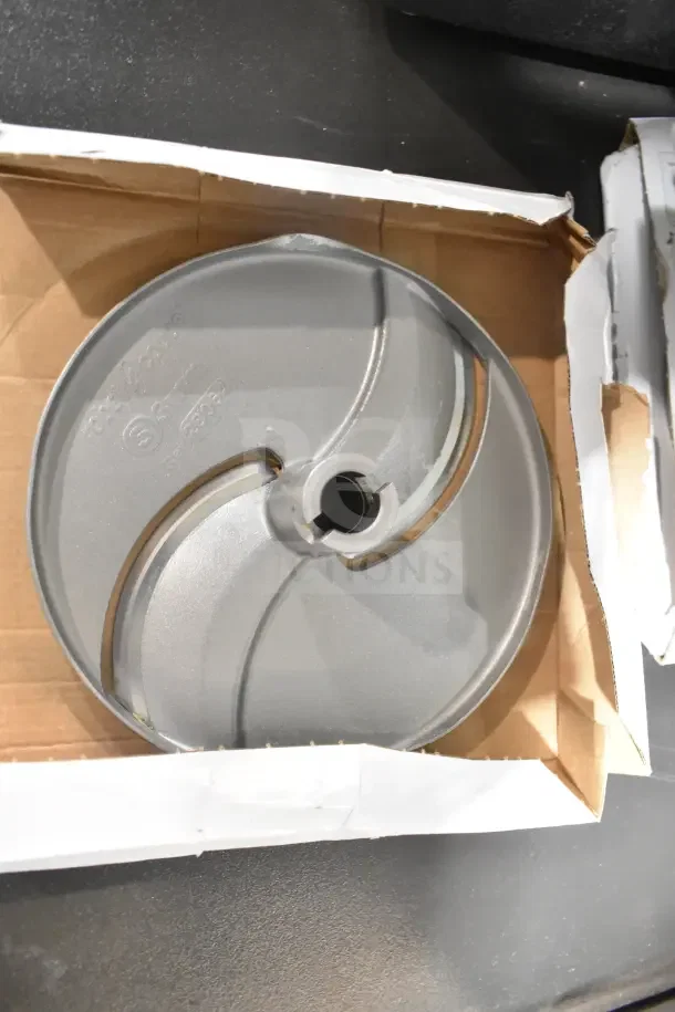 Brand new Robot Coupe CL50 blade in packaging; visible markings indicate model and specifications.