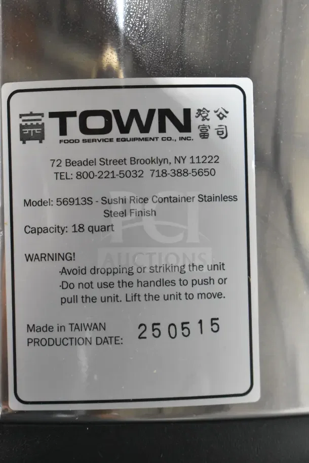 Brand new RiceMaster Town 56913S 96 Cup Sushi Rice Container, stainless steel finish, 18-quart capacity, tag visible.