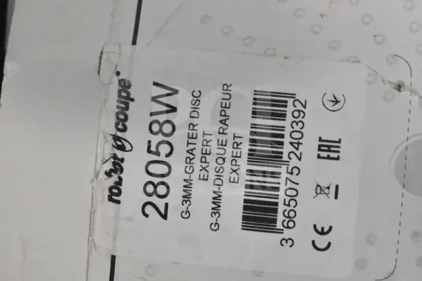 Label on Robot Coupe food processor box showing model number 28058W and grater disc details.