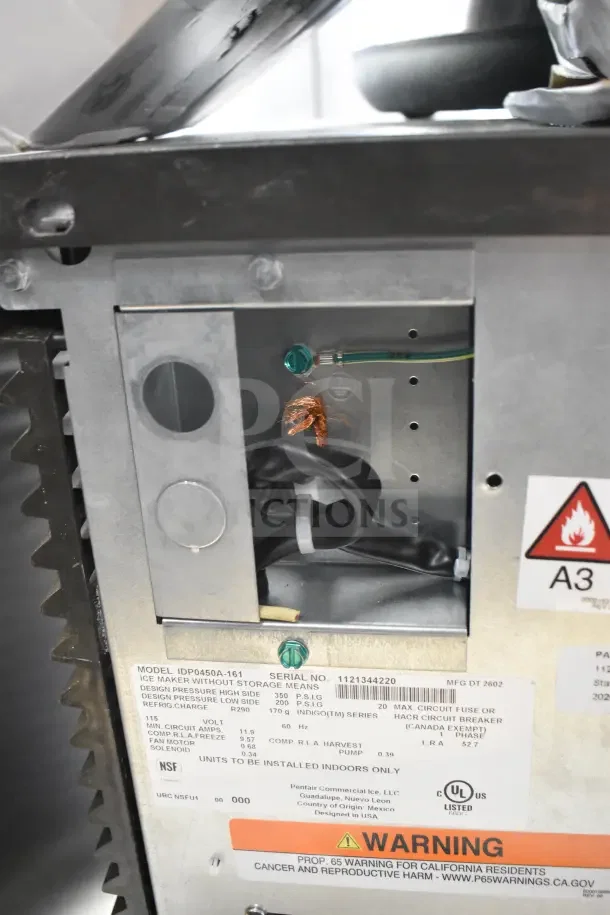 BRAND NEW Manitowoc IDP0450A-161 ice machine, 463 lb capacity, 115 volts, 1 phase. Visible warning and certification labels.