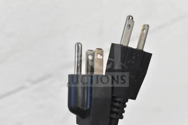 Close-up of a black electric plug for MainStreet Equipment F20E 20 lb. Dual Tank Electric Countertop Fryer, 110V, 1 Phase.