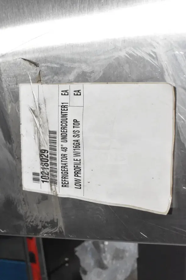 BRAND NEW 2024 True TUC-48-HC Commercial 2 Door Undercounter Cooler, 115V, with visible scratch and dent. Label shows refrigeration details.