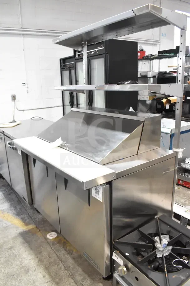 Brand new 2024 True TSSU-48-18MB-HC commercial sandwich prep table. Features 2-tier overshelf, commercial casters. 115V, 1 phase.
