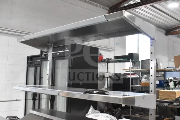 Brand new 2024 True TSSU-48-18MB-HC prep table with 2-tier overshelf and commercial casters. Scratch and dent condition.