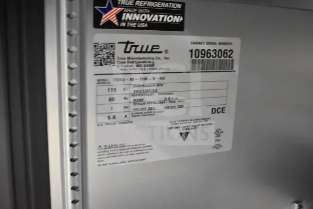 "True TSSU-48-18MB-HC Salad Prep Table, new scratch and dent, 2-tier shelf, commercial casters, 115V, label with specs."