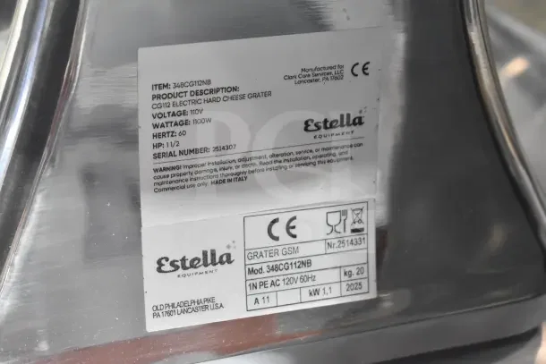 BRAND NEW Estella CG112NB electric cheese grater, 3.3 lb/min, 110V, 1 phase, minor scratches; factory label visible.