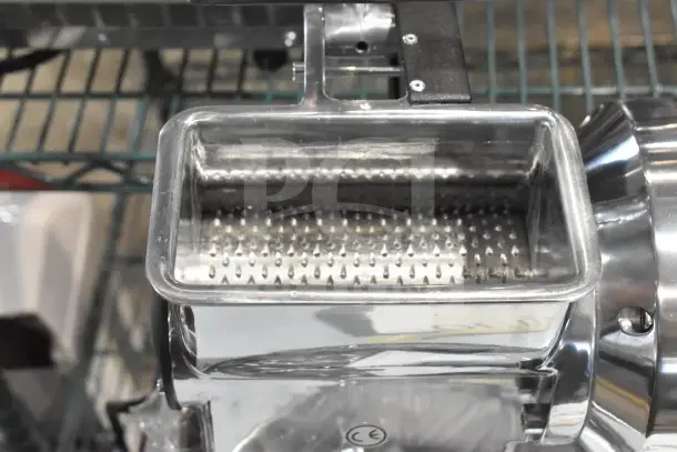 BRAND NEW Estella CG112NB electric hard cheese grater, 3.3 lb/min, 110V, visible grating component, minor scratches.