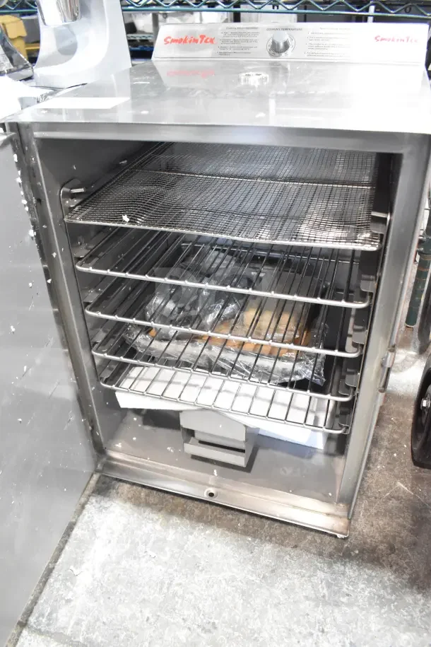 BRAND NEW SmokinTex 400 electric smoker, 120V, 1-phase, stainless steel, interior racks visible, scratch and dent condition.