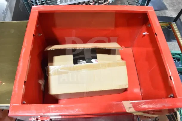 Red Carnival King Popcorn Cart, new with minor scratches, inside view with a taped cardboard box.