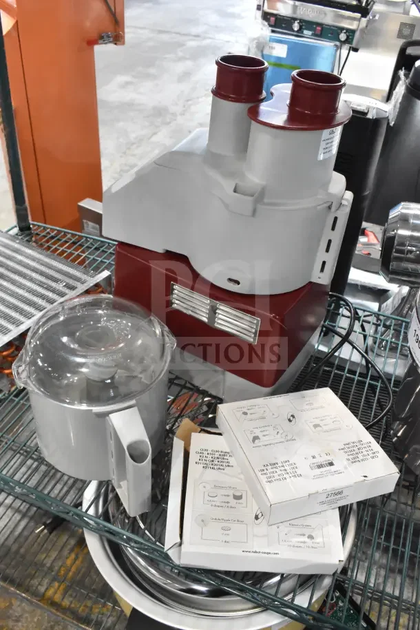 Brand new Robot Coupe R2N food processor, 3 Qt. gray bowl, continuous feed, 1 hp, 120V, includes 2 discs, slight scratch.