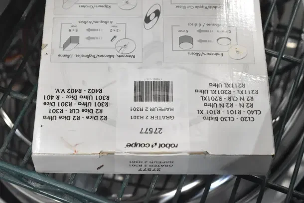 Brand new Robot Coupe R2N food processor box, featuring model details and barcode. Minor box wear visible.