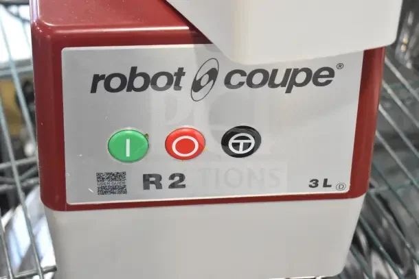 Brand new Robot Coupe R2N food processor, 3 qt gray bowl, continuous feed, 2 discs, 1 hp, 120V, with panel controls.