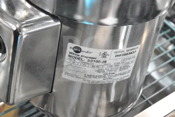 BRAND NEW InSinkErator SS-100-28 Commercial Garbage Disposer, 115/208/230V, 1 Phase; labeled with model and serial number.
