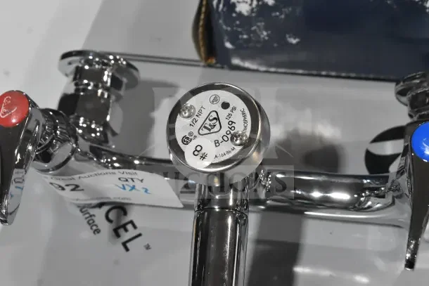 Two new chrome faucets, branded T&S, labeled B-0969, with minor scratches and dents. 1/2" NPT, 125 PSI max.