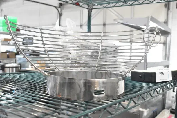 Brand new Avantco 177MX20BEATF 20 Qt. beater with silicone blade and mixer bowl guard on wire shelf.