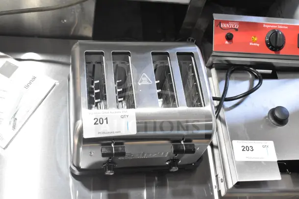 Brand new Galaxy MDT4 commercial toaster with 4 slots, 1 1/2" width, 120V, 1 phase. Scratch and dent condition visible.