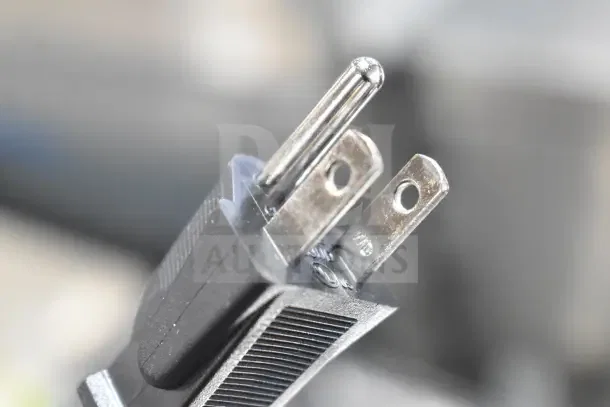 A close-up of a three-prong plug from a Galaxy MDT4 4-slice commercial toaster, indicating its electrical connection type.