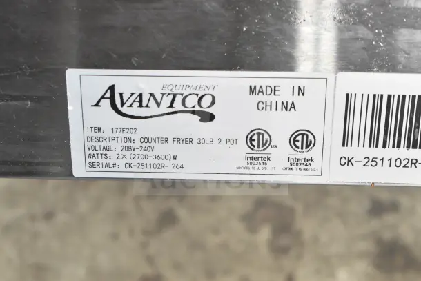 Alt text: "Avantco F202 30 lb. Dual Tank Fryer label showing item, voltage, watts, serial number, and made in China."