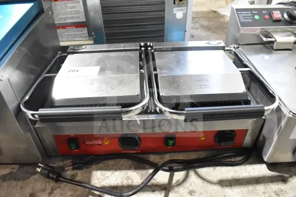Brand new Avantco PG400 dual panini grill, grooved plates, 19 5/8" x 9 1/8" cooking surface, 120V, 1 phase.