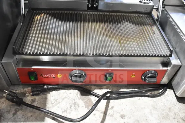 Brand new 2025 Avantco PG400 Panini Grill, grooved plates, 19 5/8" x 9 1/8" surface, 120V, minor scratches, dual temperature controls.