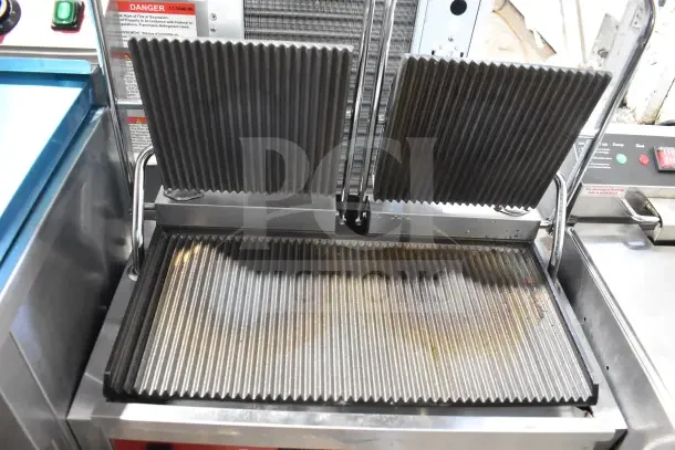 BRAND NEW 2025 Avantco PG400 Commercial Dual Panini Grill with grooved plates, 19 5/8" x 9 1/8" surface, 120V, 1 Phase.