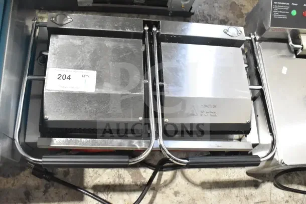 Brand new Avantco PG400 Panini Grill with grooved plates, 19 5/8" x 9 1/8" surface, sticker "204 QTY", 120V, dual handles.