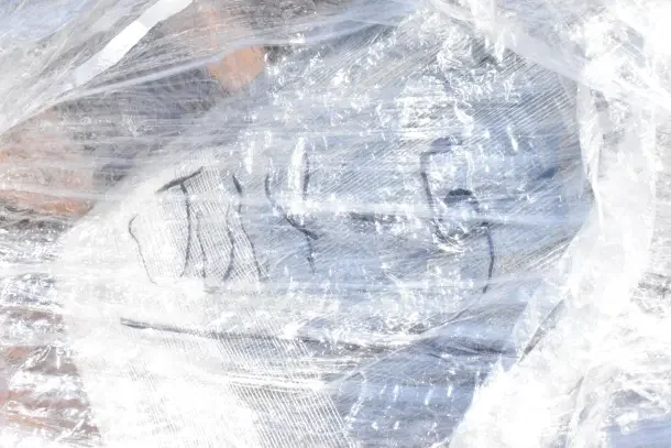Plastic-wrapped pallet containing brand new scratch and dent items, including a sink and dunnage rack. Marked with "5-JUL."