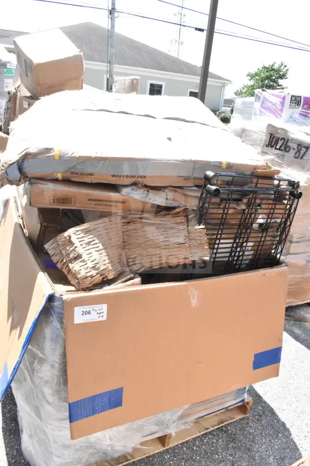 Cardboard box containing assorted new scratch and dent items, including a wire shelf. Some packaging appears worn.