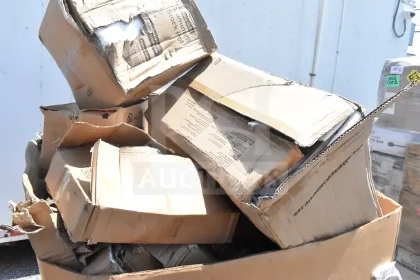Damaged boxes containing scratch and dent items, including beer box sliding lid, stock pot, and table. Auction lot of 15.