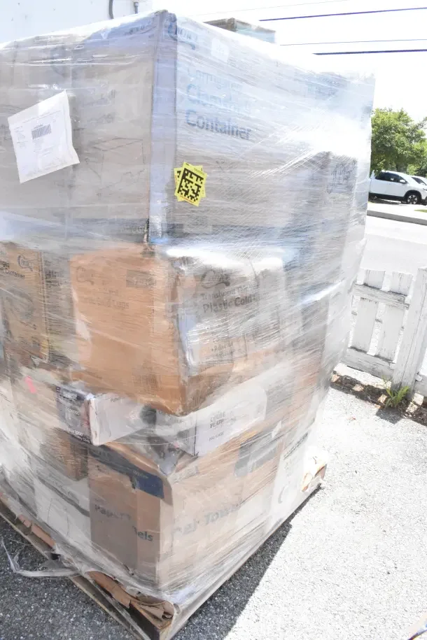 Pallet of 29 new scratch and dent items, including shot glasses, wine glasses, lids, and hot cups, wrapped in plastic.