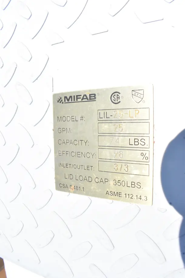 MIFAB LIL-25-LP grease trap label showing 25 GPM, 74 lbs capacity, 98% efficiency, 350 lbs lid load.