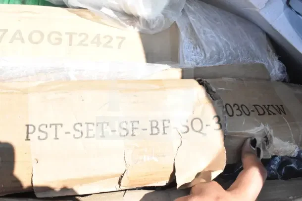 Boxes labeled "PST-SET-SF-BF-SQ-3030-DKW" and "7AOGT2427" showing scratch and dent items, including Ashland grease trap.