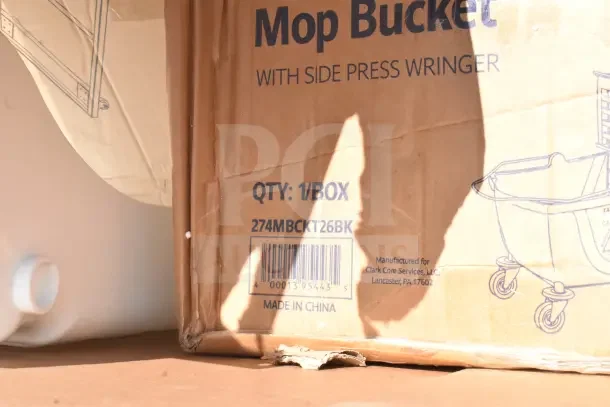 Cardboard box for mop bucket by Clark Core Services, labeled "Qty: 1/Box," model 274MBCKT26BK, made in China.