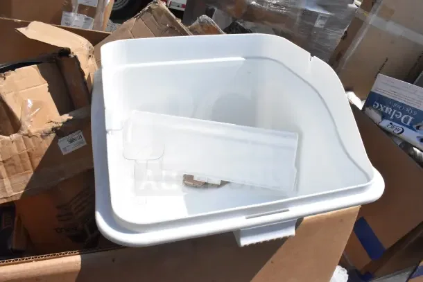 New white plastic bin, part of a lot including scratch and dent items like a chair dolly and mop bucket, in original packaging.