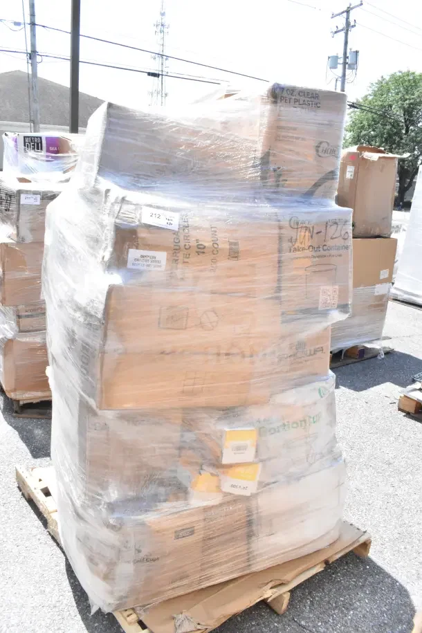 Pallet of 30 scratch and dent items including cold cups, plates, portion cups, and hot cups, wrapped in plastic.
