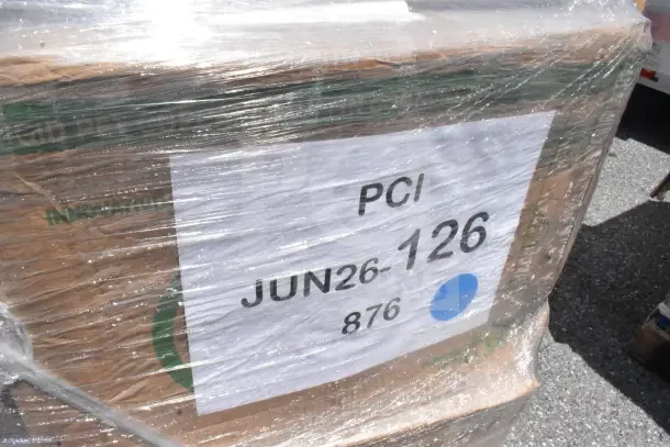 Plastic-wrapped pallet labeled "PCI JUN26-126" containing 30 brand new scratch and dent items like cups and plates.