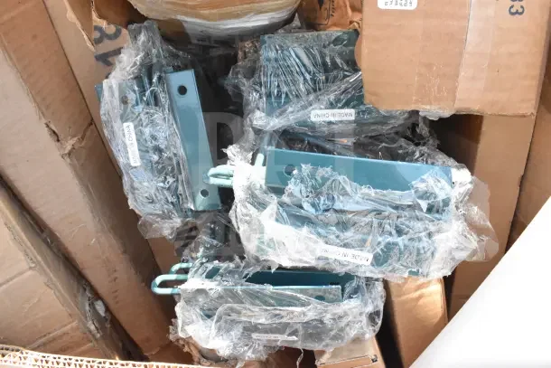 Cardboard box containing 16 brand new scratch and dent wall shelves, wire shelves, and pan racks, wrapped in plastic. Marked "Made in China."